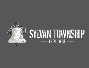 Logo for Sylvan Township. On the left, there is an illustrated bell, with the text "Sylvan Township" to the right.